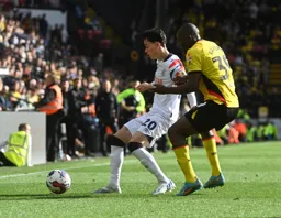 Louie Watson shields the ball from Edo Kayebe