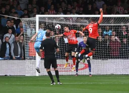 Dan Potts defends as Danny Batth threatens the Town goal