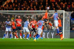Dan Potts climbs to head the ball in front of Andy Carroll