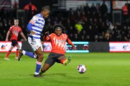Pelly Ruddock-Mpanzu goes in with a lunging tackle