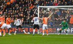 The ball goes across the Blackpool goalmouth