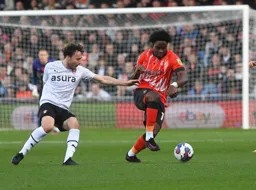 Pelly Ruddock-Mpanzu gets his head down and goes on a run forward