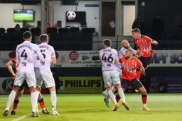 Dan Potts sends a header towards goal