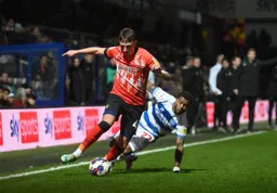 Alfie Doughty goes past Kenneth Paal