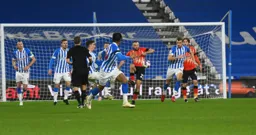 Allan Campbell volleys the ball clear from danger