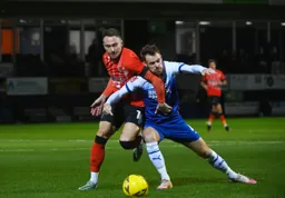 Cauley Woodrow fights for the ball against Tom Naylor