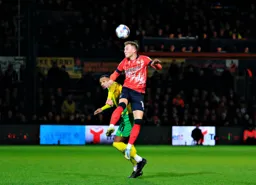 Cauley Woodrow gets above Matt Phillips to head the ball forward
