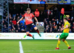Alfie Doughty flicks the ball on
