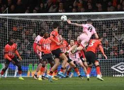 Gavan Holohan gets above Dan Potts to head in Grimsby`s first goal
