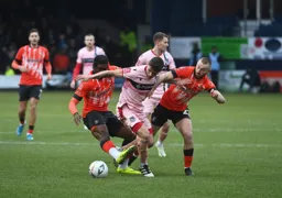 Pelly Ruddock-Mpanzu and Allan Campbell combine to halt this Grimsby attack