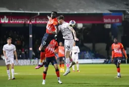 Elijah Adebayo wins this heading duel