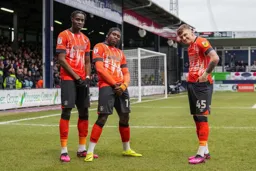Pelly Ruddock-Mpanzu celebrates his goal with Elijah Adebayo and Alfie Doughty