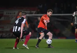 Luke Berry looks to control the ball