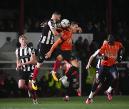The ball gets jammed between Luke Waterfall and Cauley Woodrow