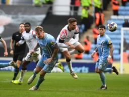 Jordan Clark leaps past Kyle McFadzean