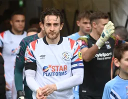Tom Lockyer leads the team out
