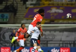 Pelly Ruddock-Mpanzu gets in a flying header