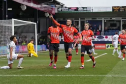 Carlton Morris salutes his goal with Elijah Adebayo and Alfie Doughty
