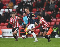 Cauley Woodrow works his way past Max Lowe