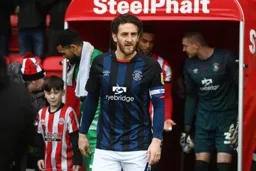 Tom Lockyer leads the team out