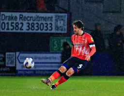 Tom Lockyer clears the ball down field