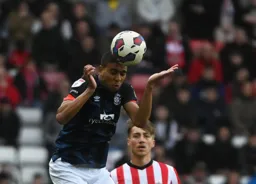 Cody Drameh gets his head to the ball