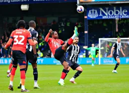 Pelly Ruddock-Mpanzu clears the ball