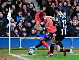 Elijah Adebayo is trapped by the corner flag
