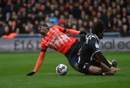Amari`i Bell suffers a painful challenge from Hamza Choudhury