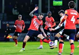 Sonny Bradley gets his foot to the ball
