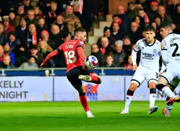 Jordan Clark flicks the ball on