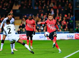 Alfie Doughty plays the ball down the touchline