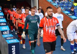 Sonny Bradley leads the team out