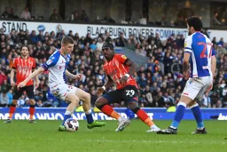 Amari`i Bell nips in between two defenders