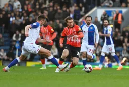 Luke Freeman evades a tackle