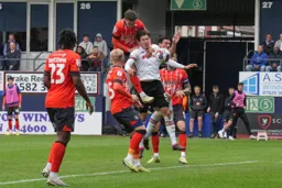 Dan Potts climbs all over Alfie Jones