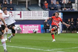 Luke Freeman takes a shot at goal