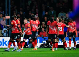 Players celebrate Tom Lockyer`s goal