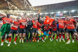 Celebrating with their thoughts towards Tom Lockyer