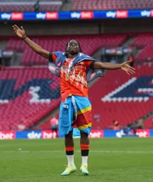 Pelly Ruddock-Mpanzu with D.R. Congo flag