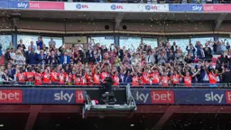 Sonny Bradley lifts the trophy