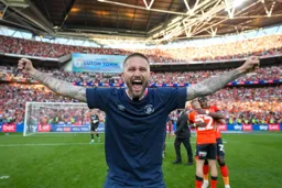 Henri Lansbury celebrates