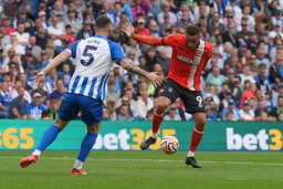 Carlton Morris takes on Lewis Dunk