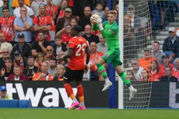 Thomas Kaminski gathers the ball