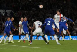 Tom Lockyer gets up high to head towards goal