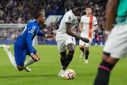 Elijah Adebayo moves past the Chelsea defender