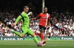 Jacob Brown beaten to the ball by Fulham keeper Leno