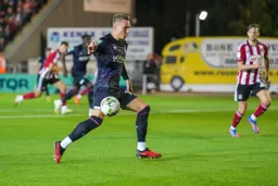 Cauley Woodrow brings the ball under control