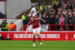 Teden Mengi sits on Chris Woods back