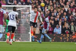 Tom Lockyer gets a good defensive header away